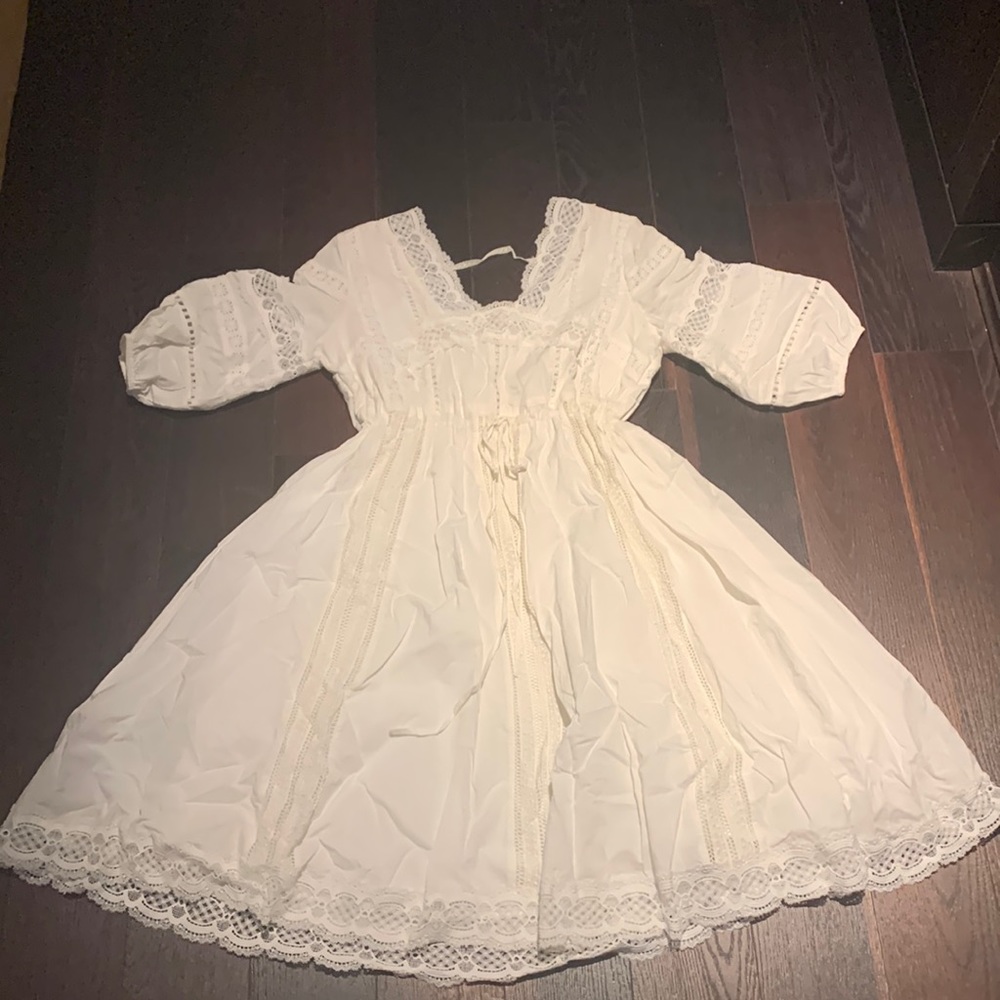 Beautiful white dress with lace details and cinch drawstring waist.